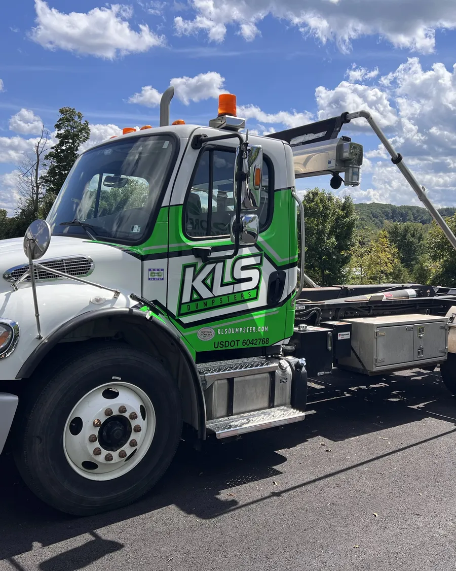 KLS Dumpster roll-off truck on site at a commercial property near Telford, PA