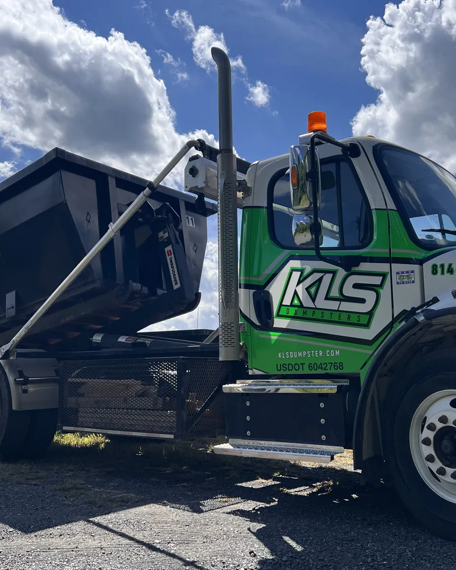 KLS Dumpster roll-off truck with a container ready for a job site in Telford, PA